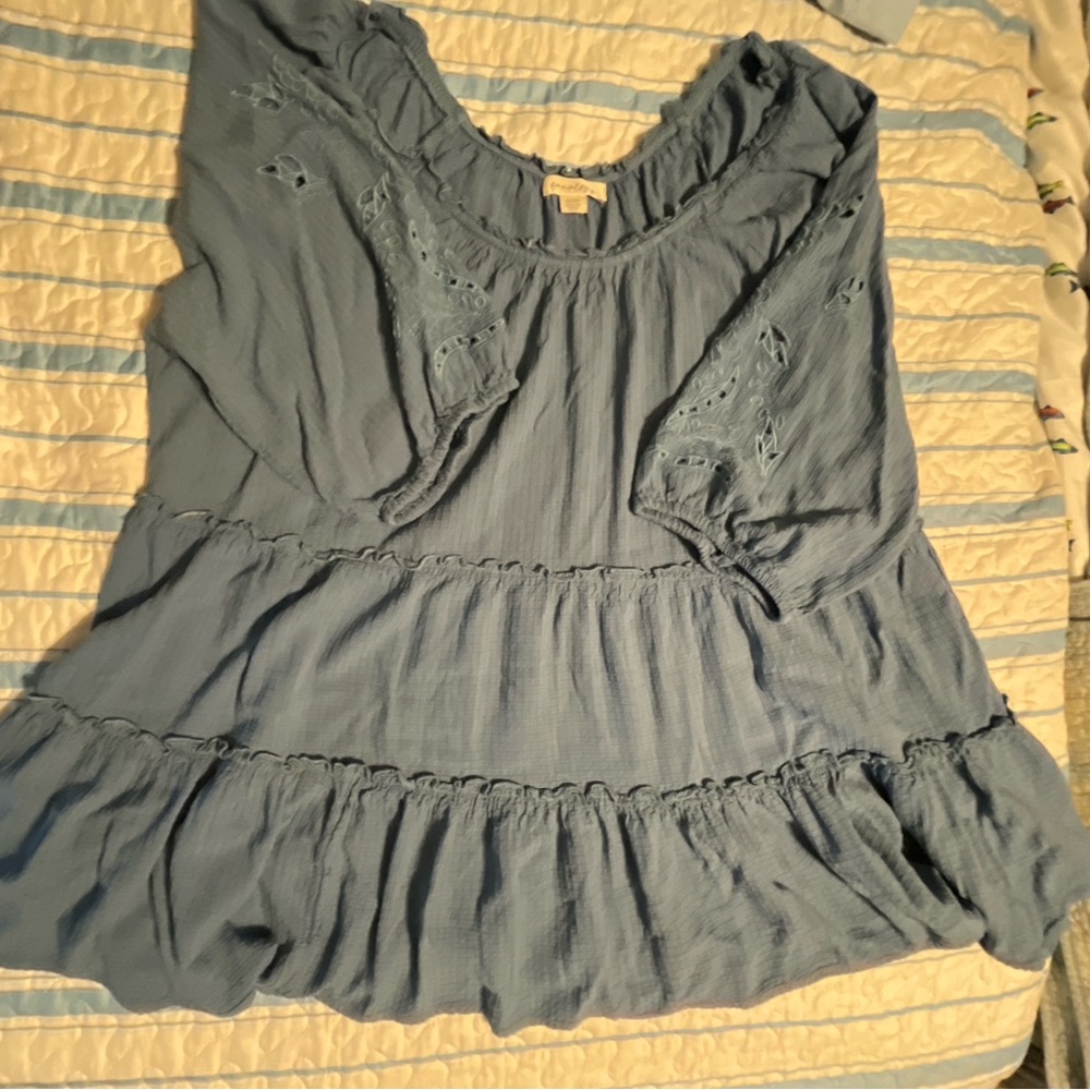 Beautiful blue top with decorated sleeves, size 22/24 and never worn.